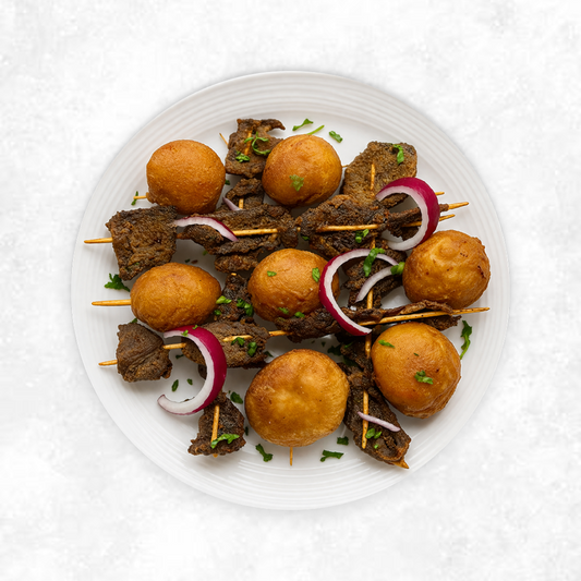 Suya Beef with Jollof Rice and Sautéed Spinach and Kale