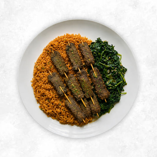 Suya Beef with Jollof Rice and Sautéed Spinach and Kale